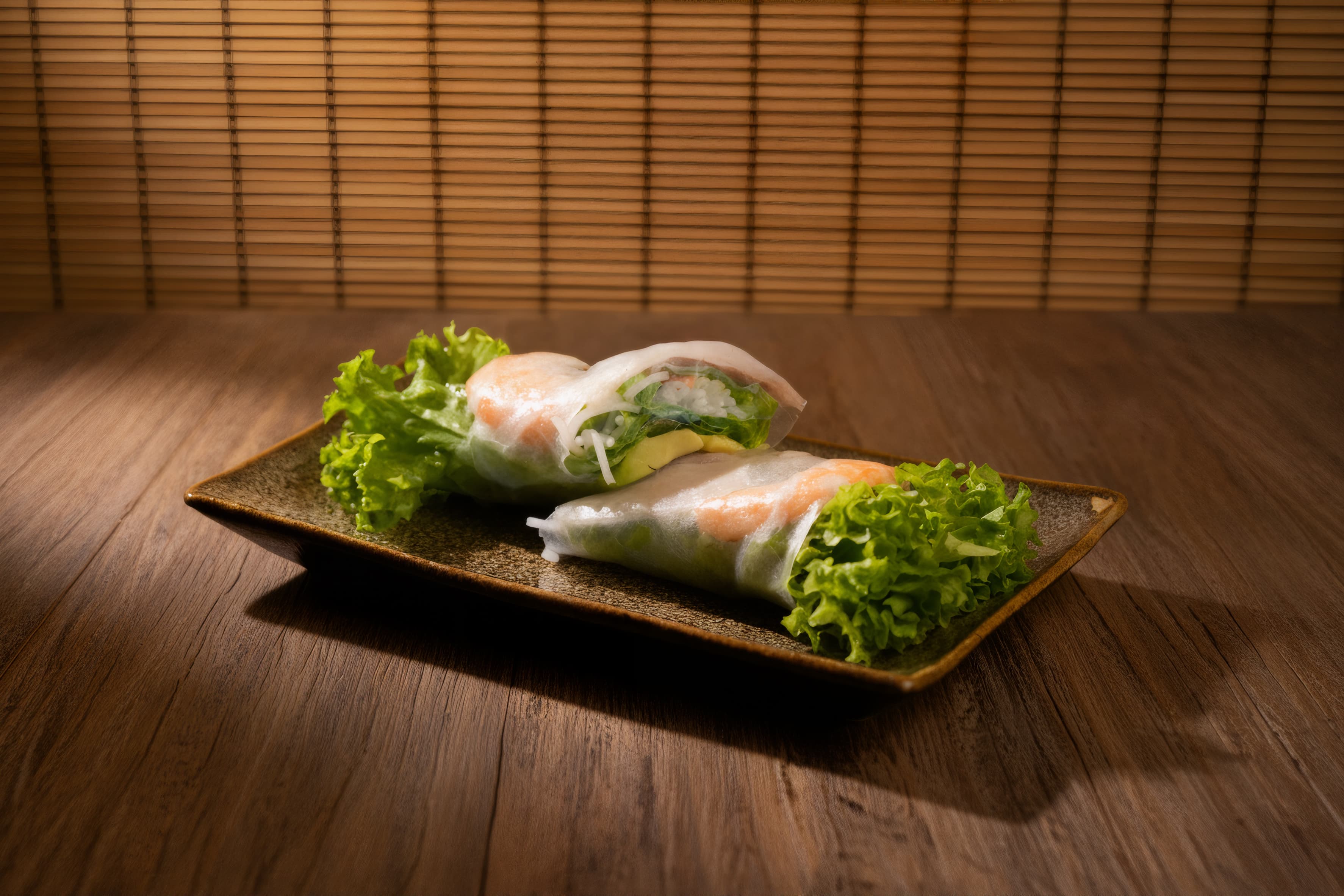 Avocado and mushroom summer roll on a stone plate